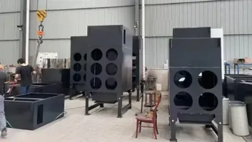 Engineer reviewing laser cutting table and dust extraction requirements